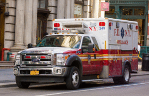 Ambulance on city street illustrating social implications of AI in emergency medical services